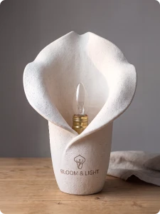 Ceramic lampshade with a brand logo engraved.