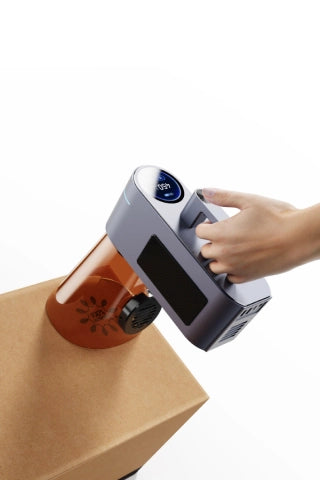 Handheld LaserPecker LP4 engraving on a large surface at a flexible angle.