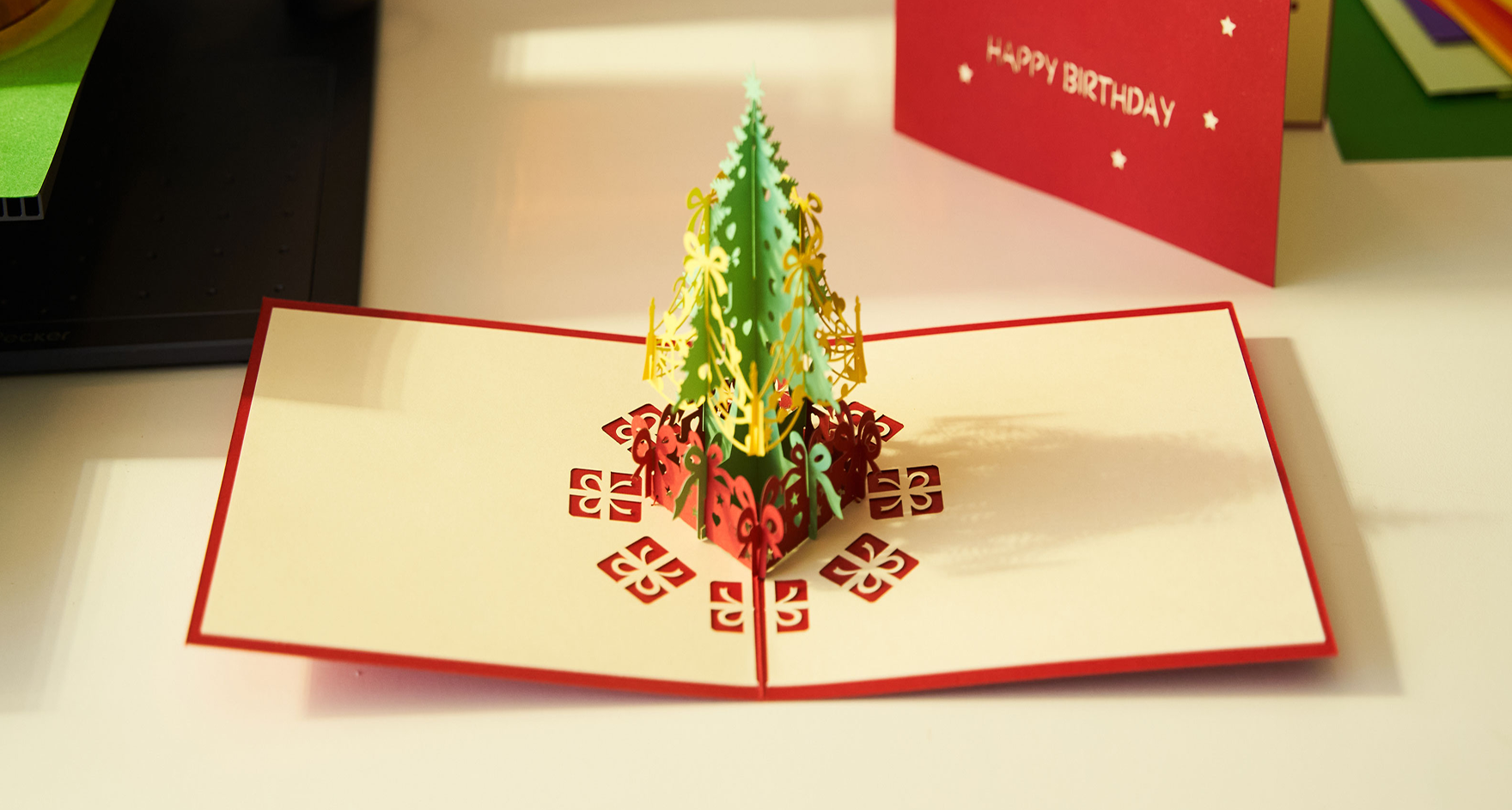 An intricate 3D pop-up greeting card crafted from cardstock laser cut by LaserPecker LP4.