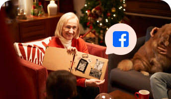 A woman happily receiving a handmade Christmas gift.