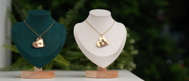 A pair of heart-shaped necklaces.