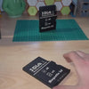 A Maker using LaserPecker LP4 to engrave a custom logo onto a 3D printed black PLA SD card box